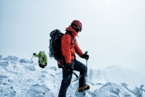 two-person-climbing-snowy-mountain