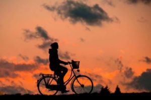 silhouette-of-person-riding-a-bike-during-sunset
