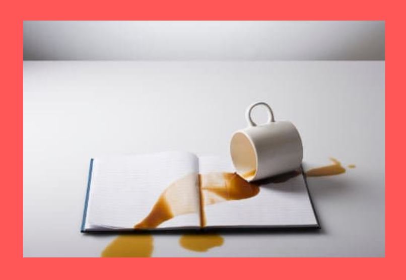 spilled-coffee-on-book-red-background
